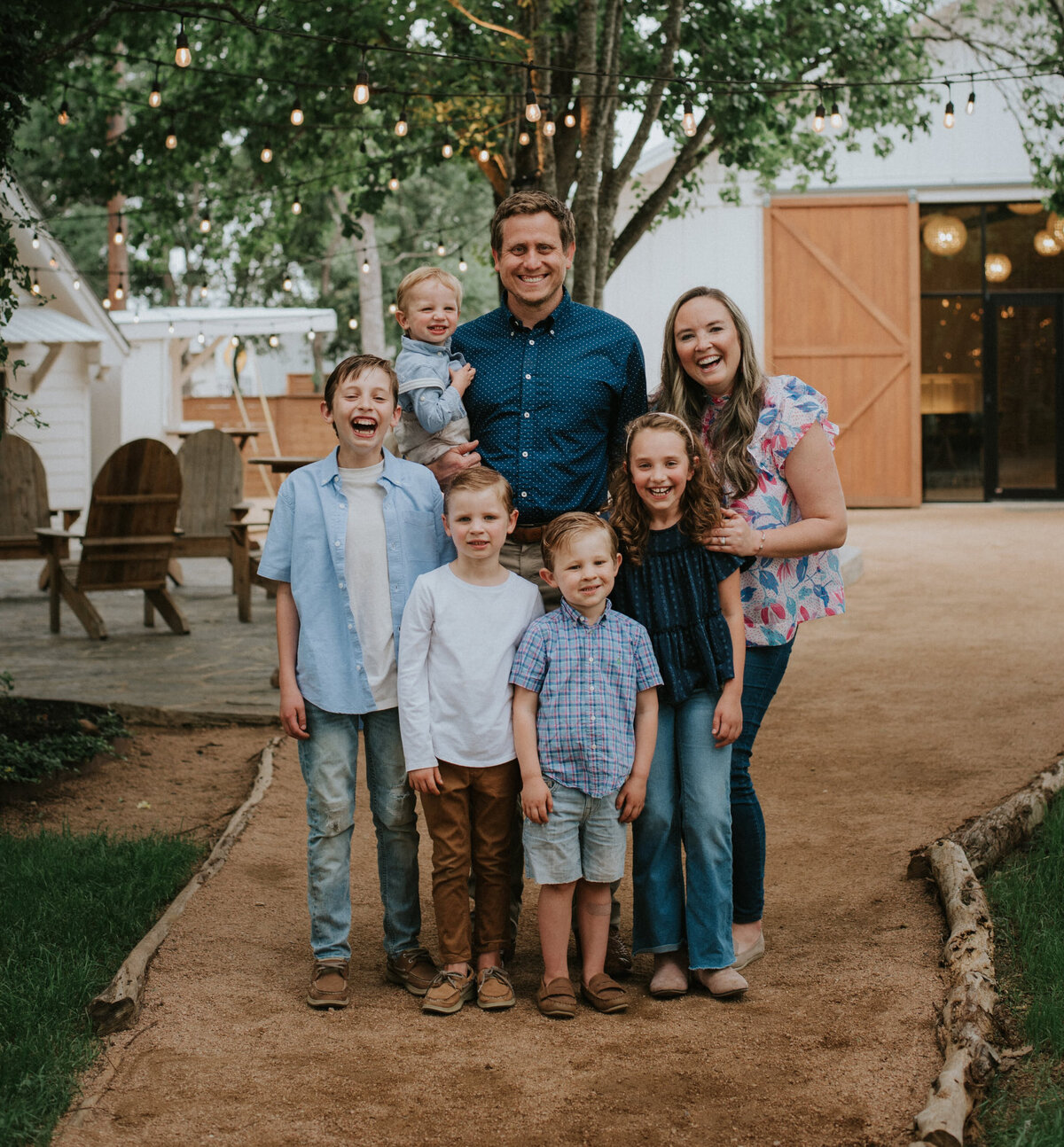 Emily and Michael with their family standing outside the chapel